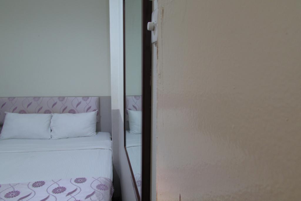 Meriton Hotel Singapura Quarto foto